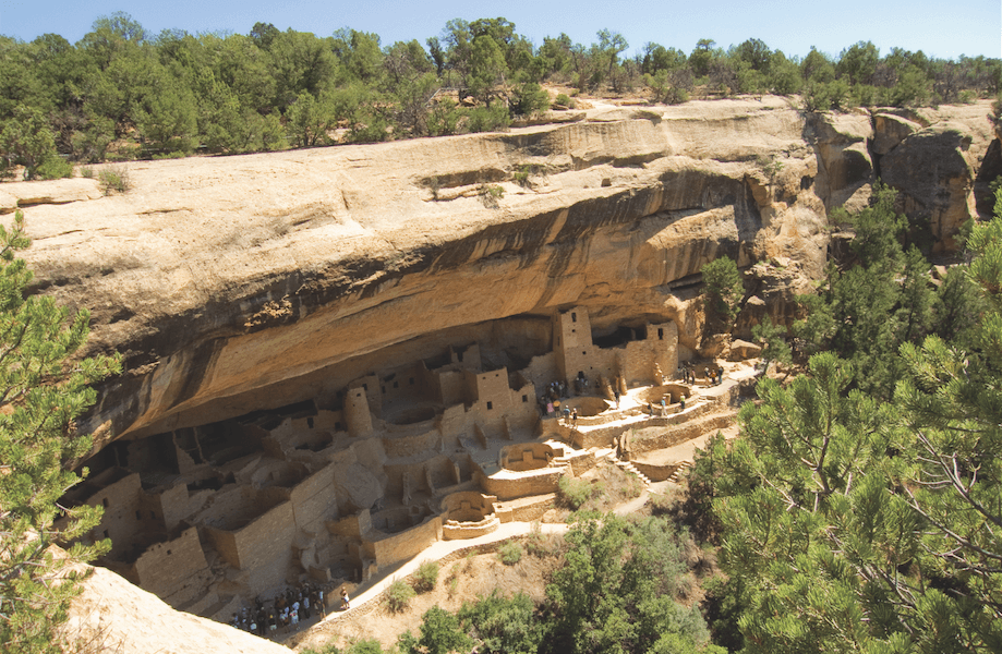 Cave dwellings are carved into a large rock face