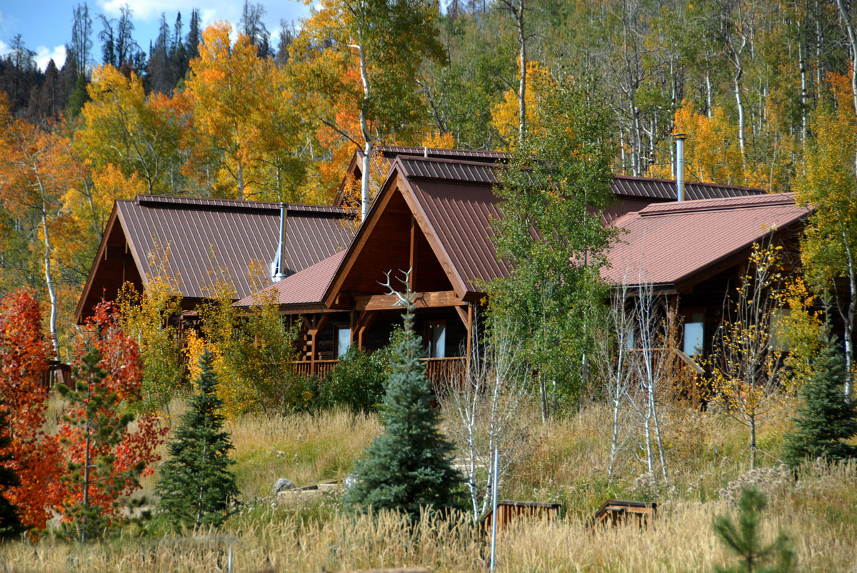 Sand Mountain Cabin surrounded by bright fall trees at Vista Verde in Colorado