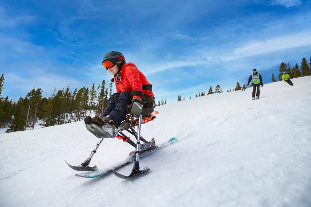 Skier with disabilities on adaptive skis in Winter Park, Colorado