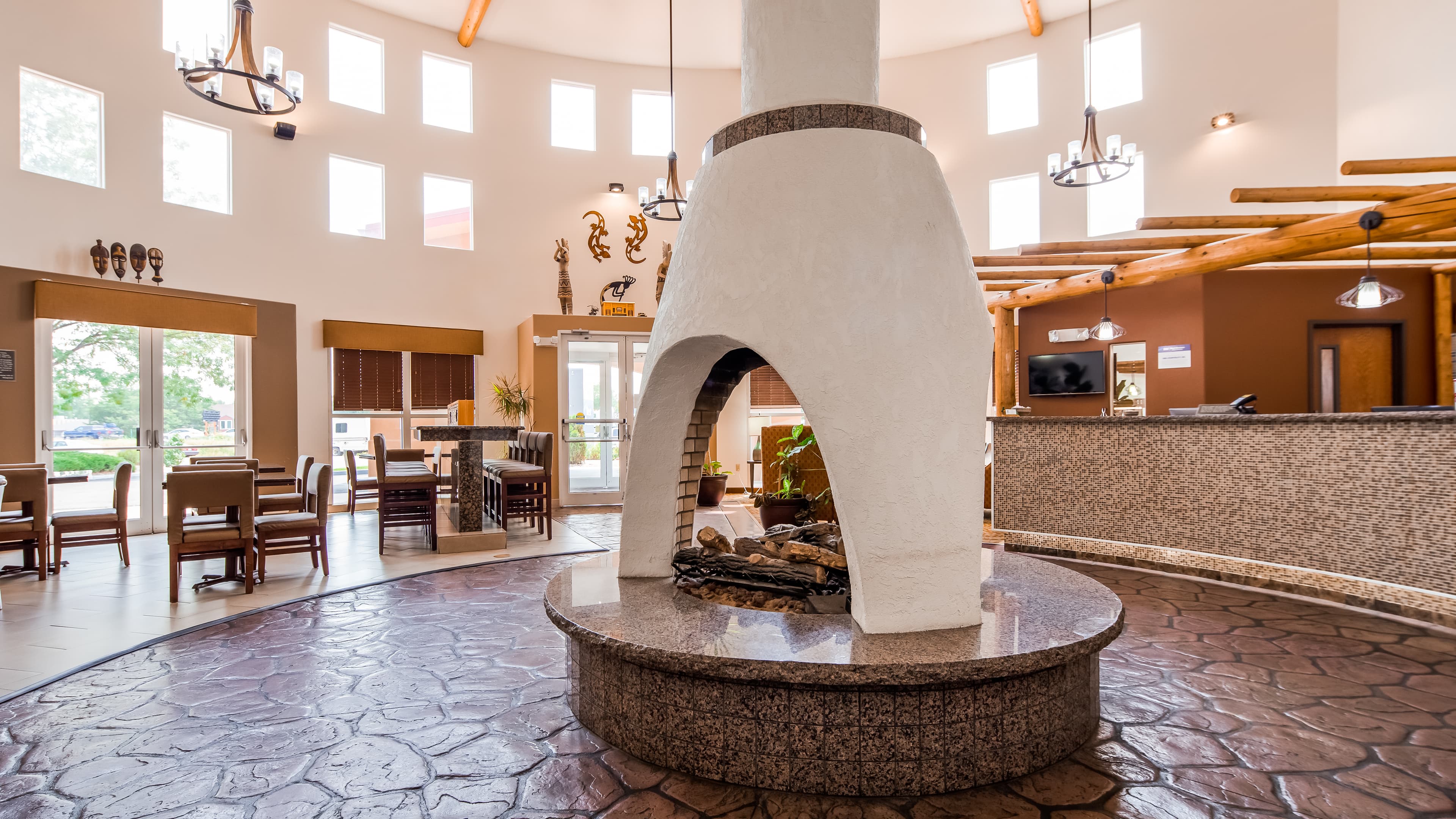A kiln-like fireplace in the bright and airy lobby of Best Western Kiva Inn in Fort Collins Colorado