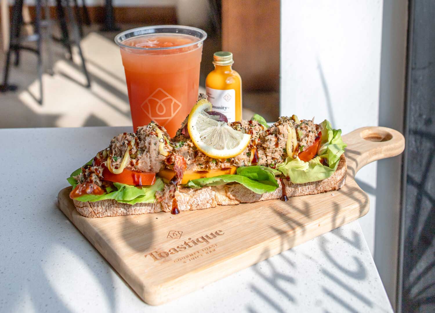A platter of gourmet toast and fruit juice