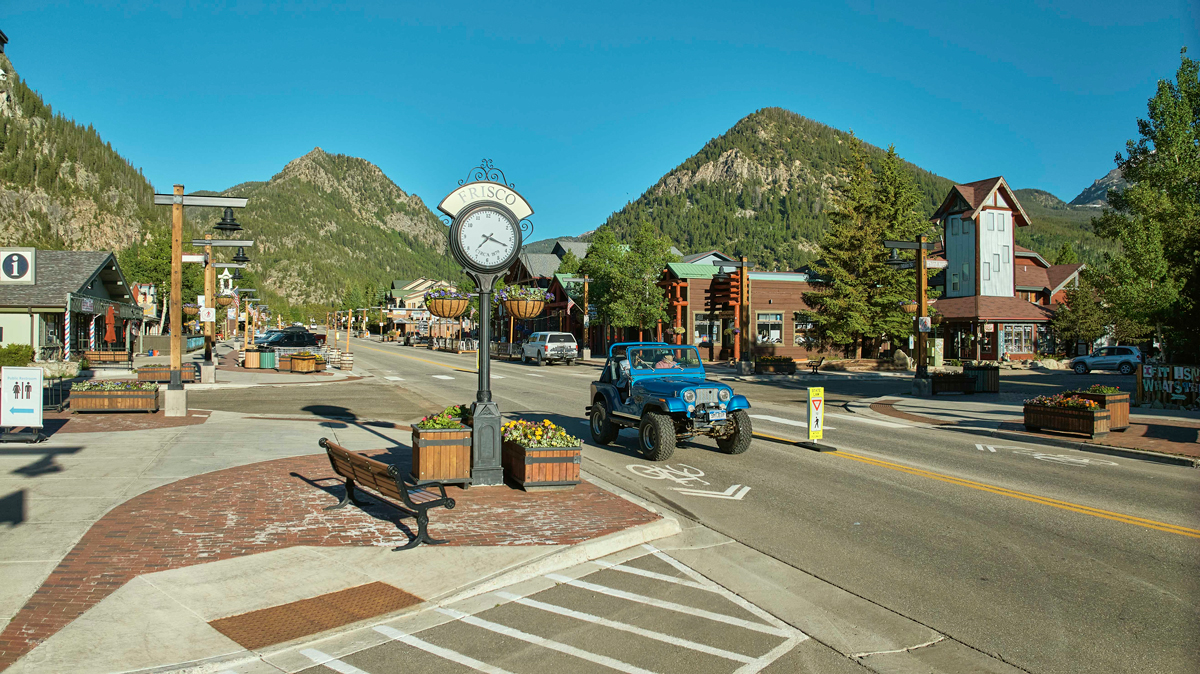 A blue jeep drives down Frisco, Colorado Main Street in summer