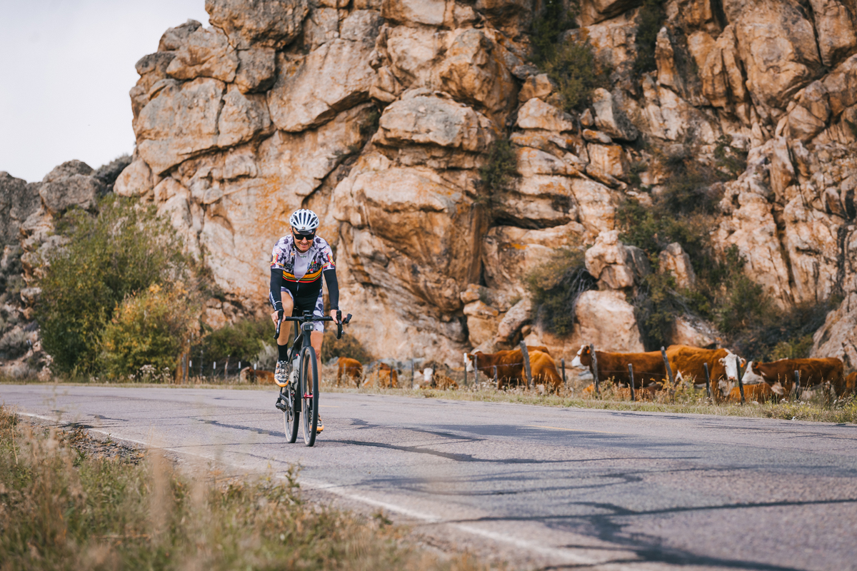 A cyclist rides down