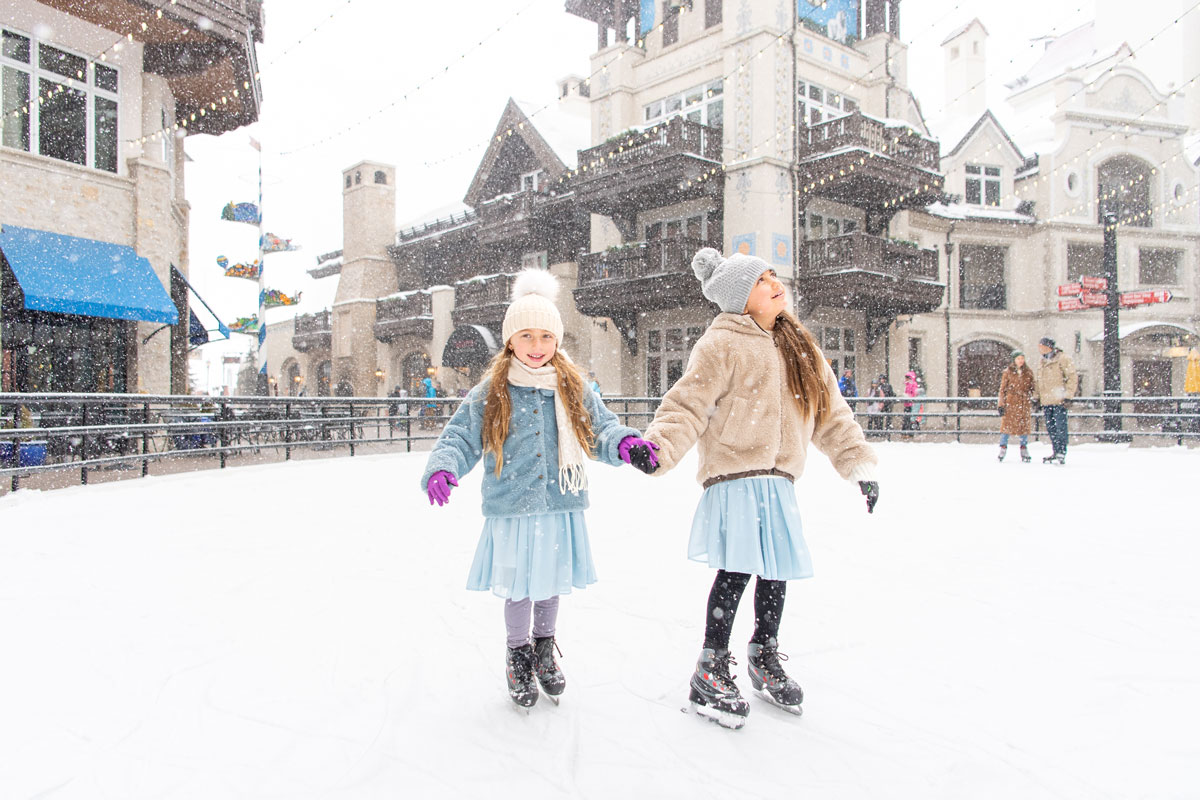 Family ice skating during winter at Vail Colorado