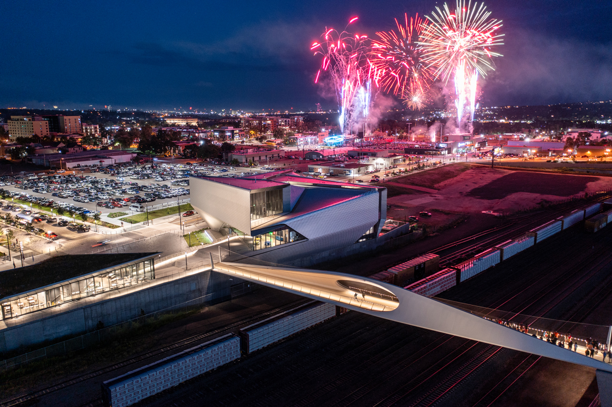 An aerial shot of fireworks going off behind the U.S. Olympic & Paralympic Museum in Colorado Springs