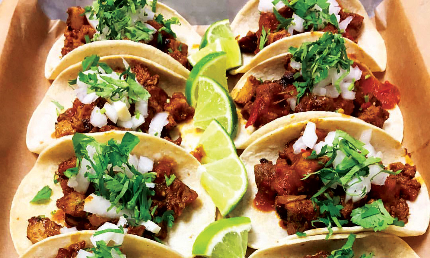 Corn-tortilla street tacos with meat, cheese and cilantro at Jefes Tacos & Tequila in Longmont