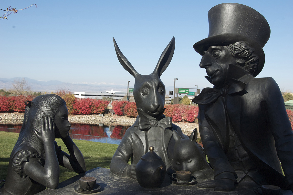 Metal statues of the Mad Hatter, Alice, the rabbit and other characters from Alice in Wonderland at the Museum of Outdoor Arts