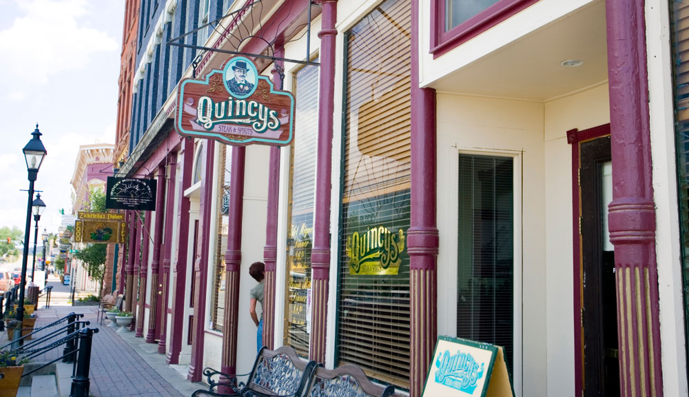 Colorful storefronts along the street in a mountain town