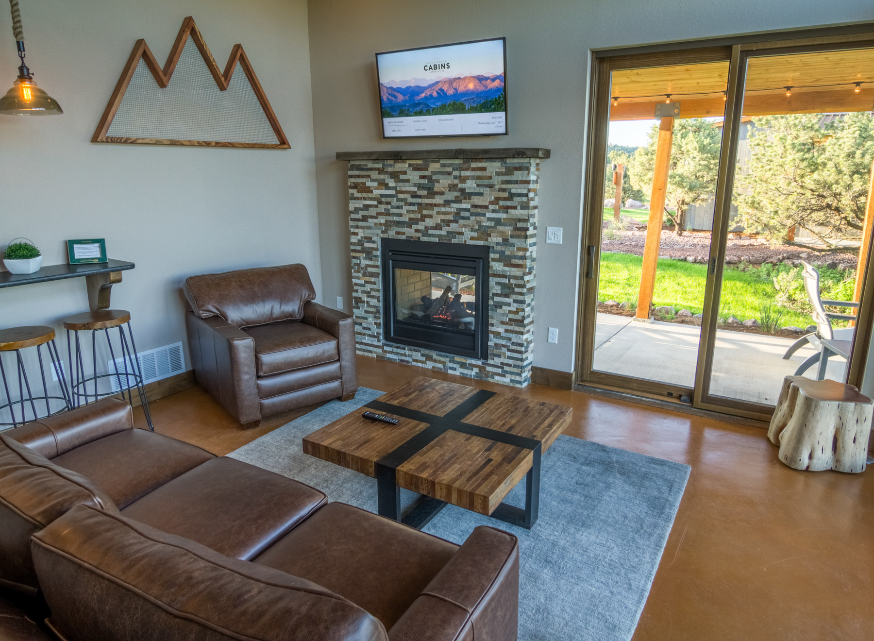 living room with fireplace and leather sofa photo 7